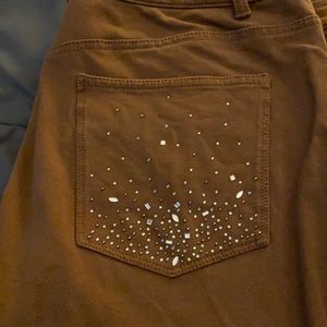 Jeans, brown w sequined pockets. No holes.
